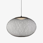 Mesh pendant cluster light suspended over a table