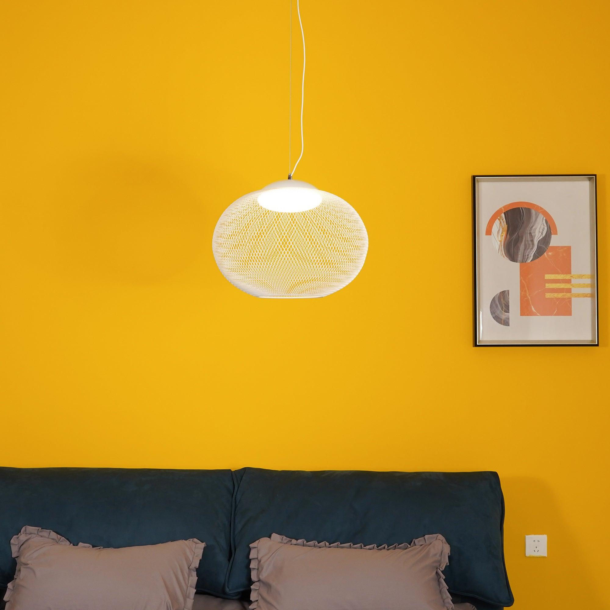 Clustered iron mesh pendant lights glowing as a group