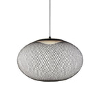Iron lattice pendant light glowing in a warm interior