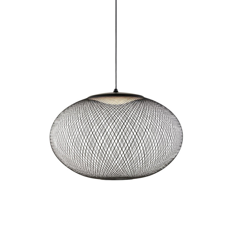 Mesh shade pendant light suspended in a styled room