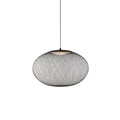 Latticed iron mesh pendant light glowing softly overhead