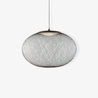 Iron lattice pendant light shown in an interior setting