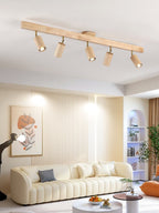 Natural wood spotlight heads casting soft focused light