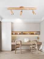 Wood-shade spotlight bar mounted on a ceiling indoors