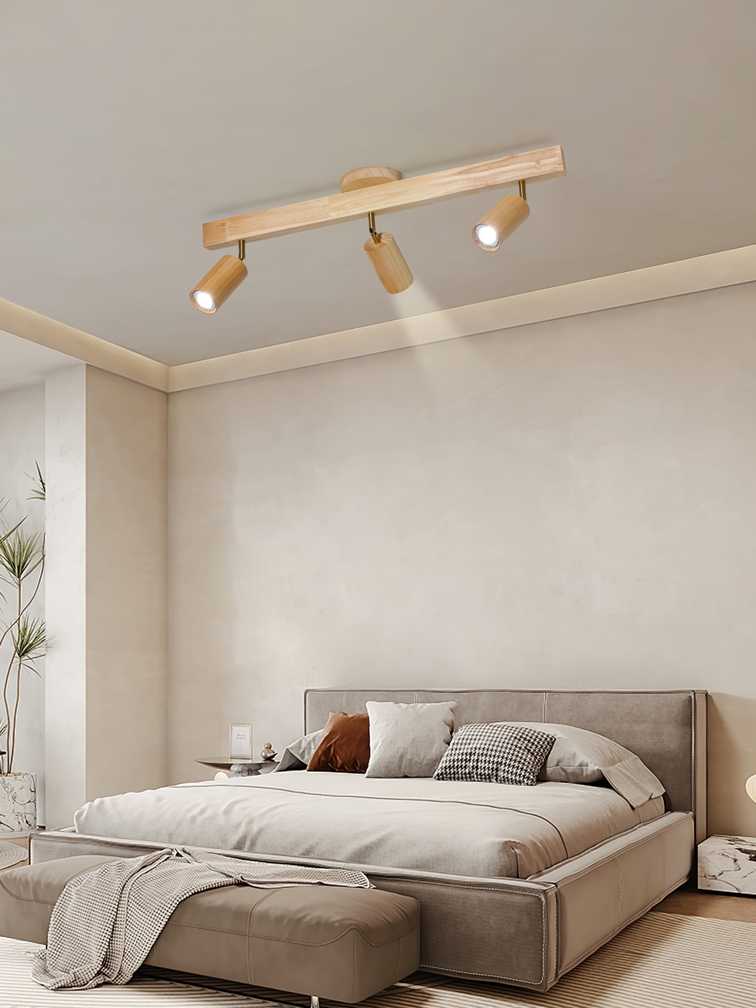 Multi-head natural wood track spotlight in a styled room
