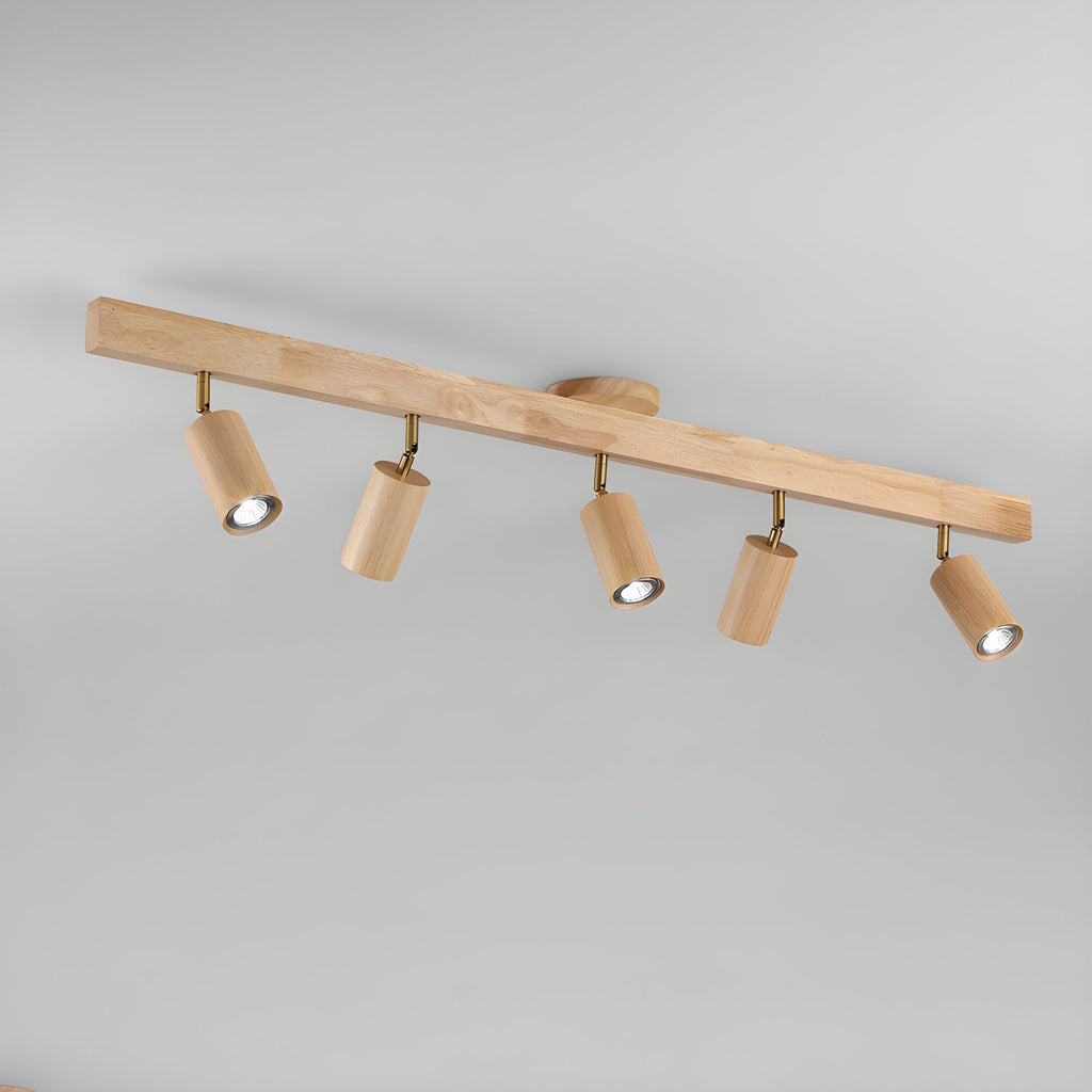 Track spotlight with walnut wood shades against a wall