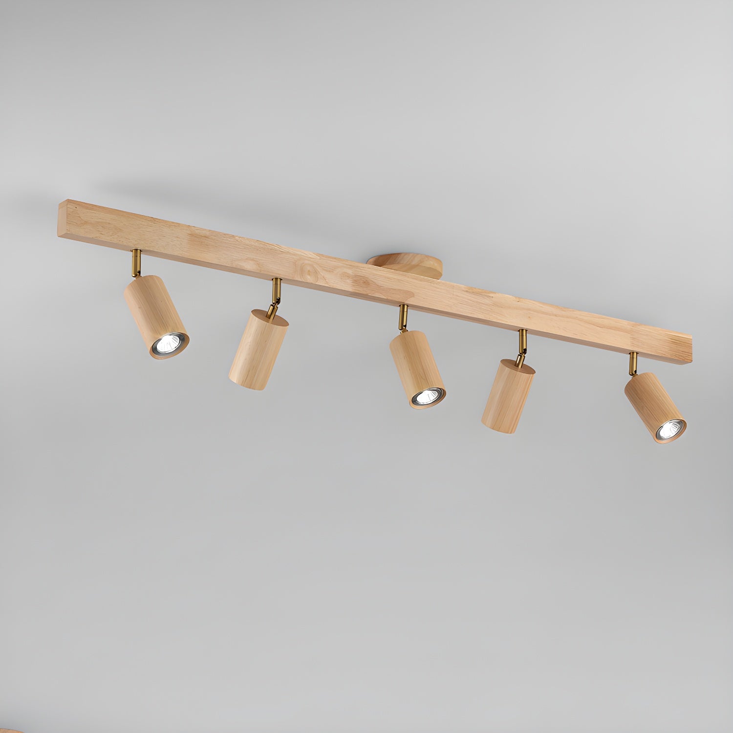 Track spotlight with walnut wood shades against a wall