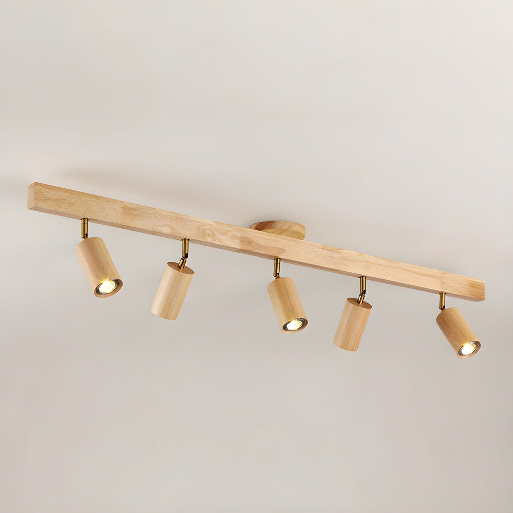 Wood track spotlight with adjustable heads glowing warmly