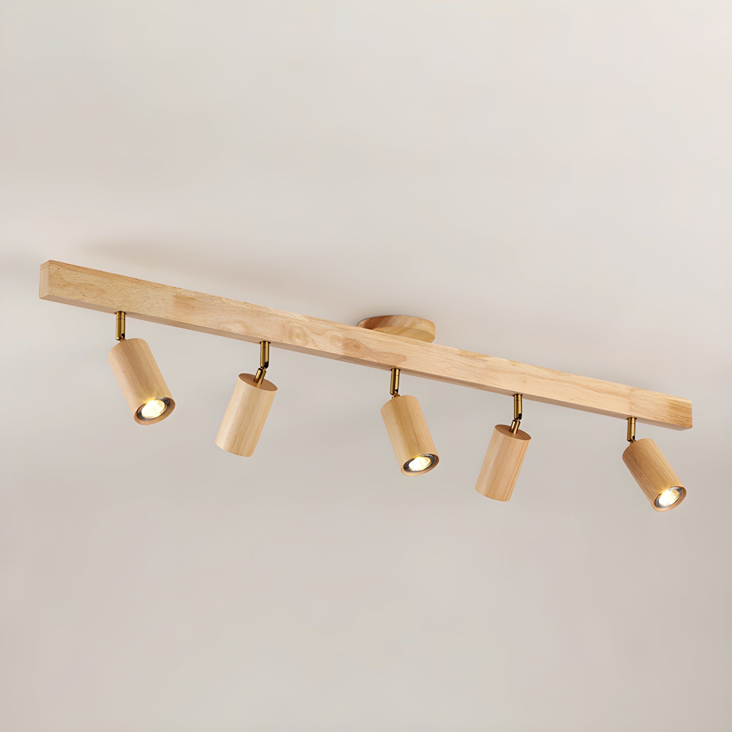 Wood track spotlight with adjustable heads glowing warmly