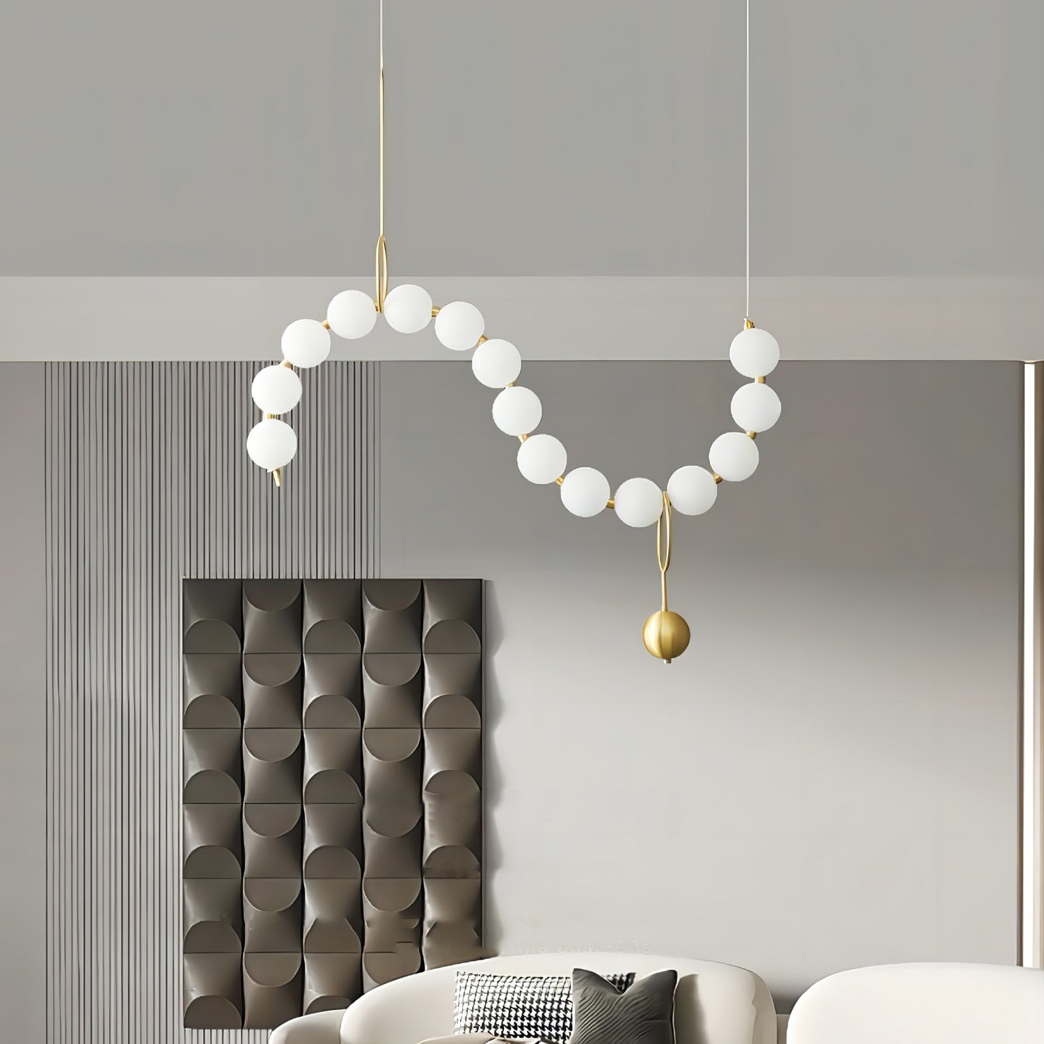 Necklace pendant light arranged along a long surface