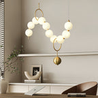 Necklace pendant light curved into a graceful arc of globes