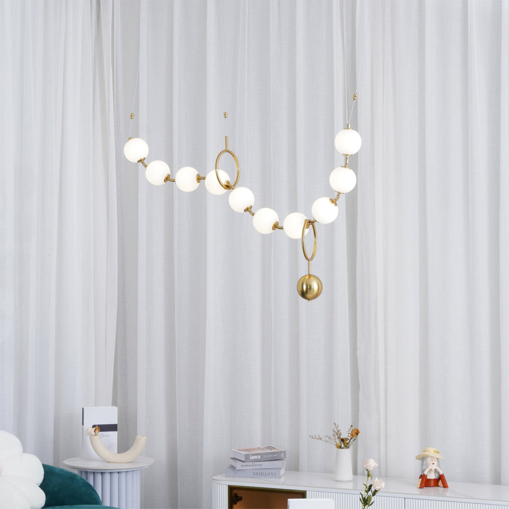 Necklace pendant light with luminous glass globes overhead