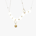 Necklace pendant light draped above an interior space