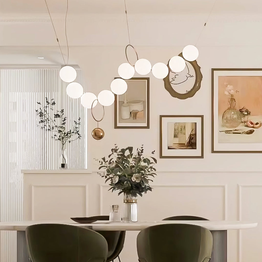 Necklace pendant light string of globes against a wall