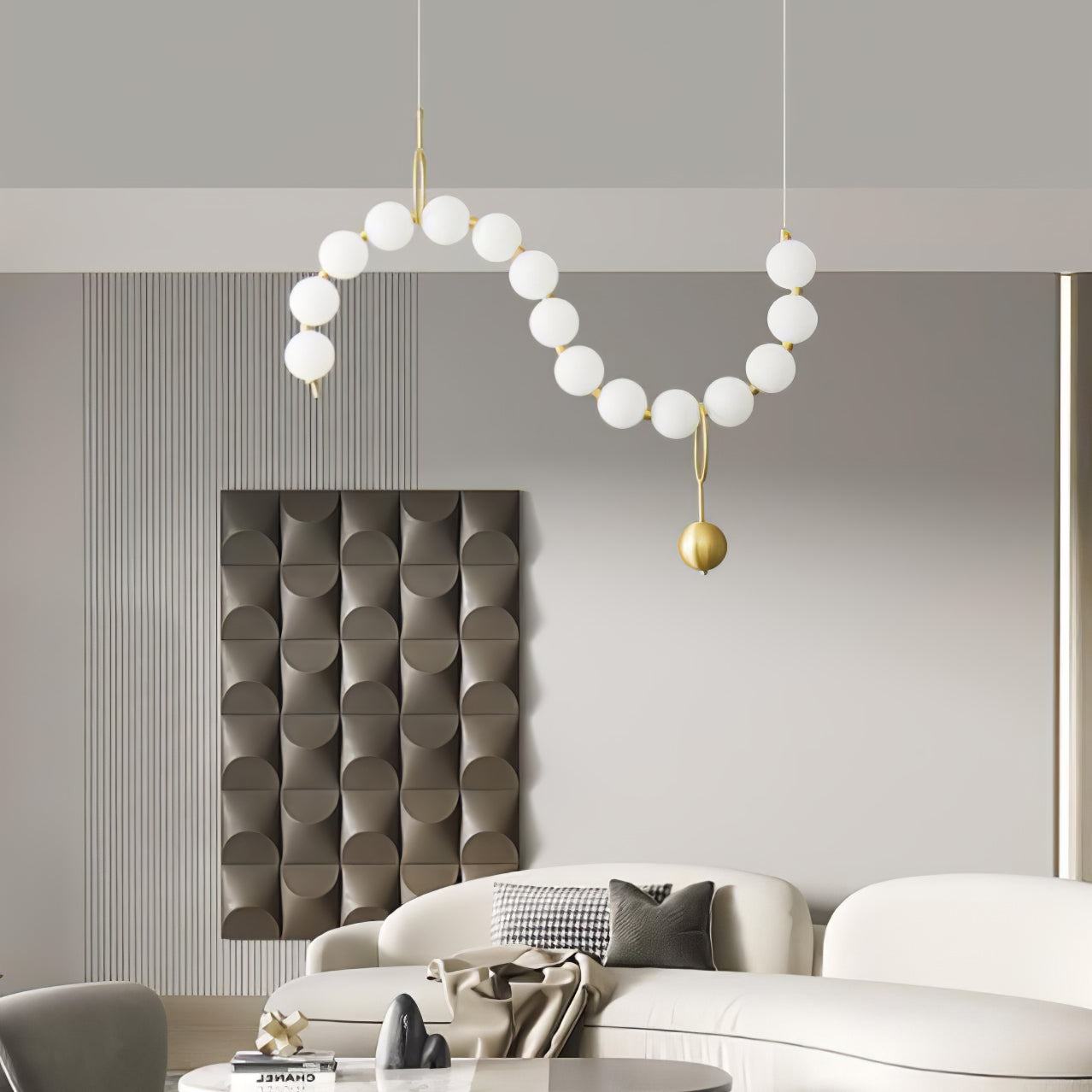 Necklace pendant light shown glowing above a room