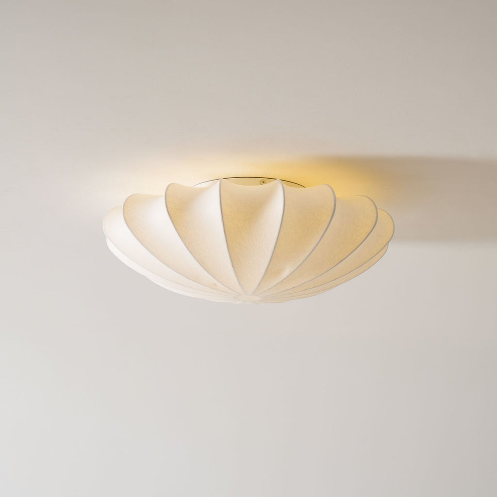 Nelson Bubble ceiling lamp hung in a cluster at staggered heights in an interior