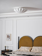 Nelson Bubble ceiling lamp with a silk cover over a steel wireframe casting a soft glow