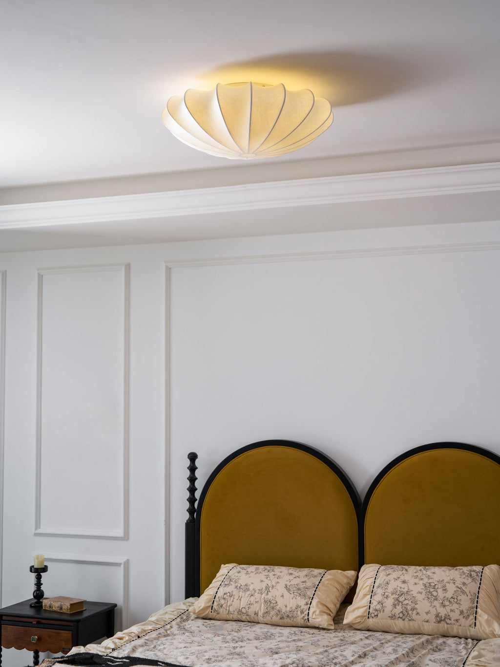 Nelson Bubble ceiling lamp over a dining setting giving off a warm refined light