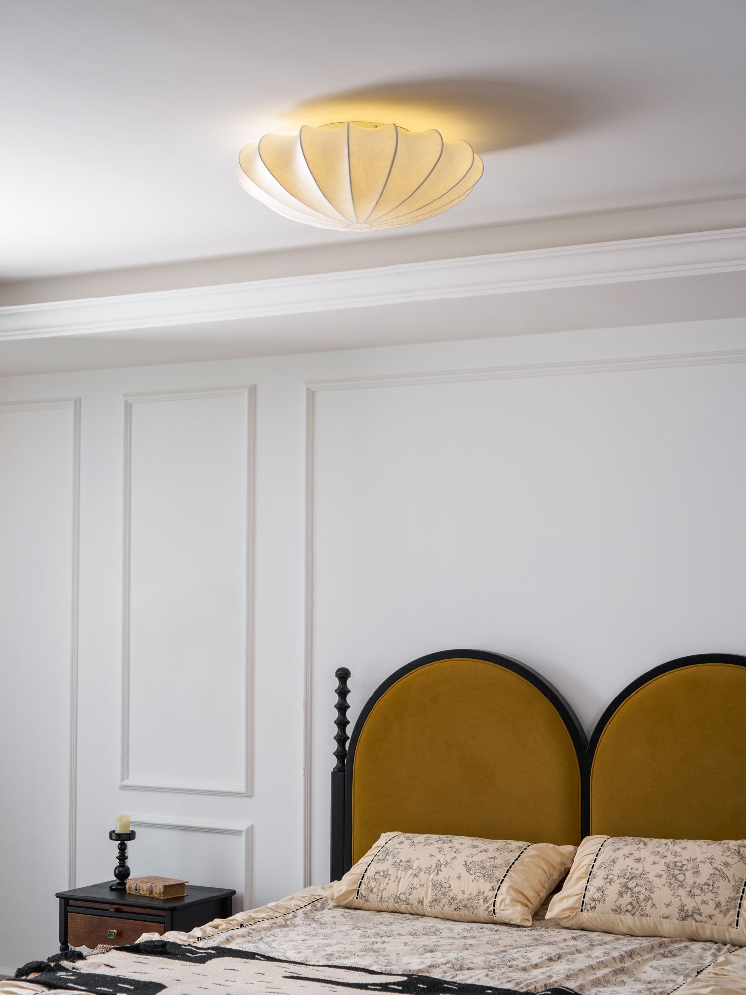 Nelson Bubble ceiling lamp over a dining setting giving off a warm refined light