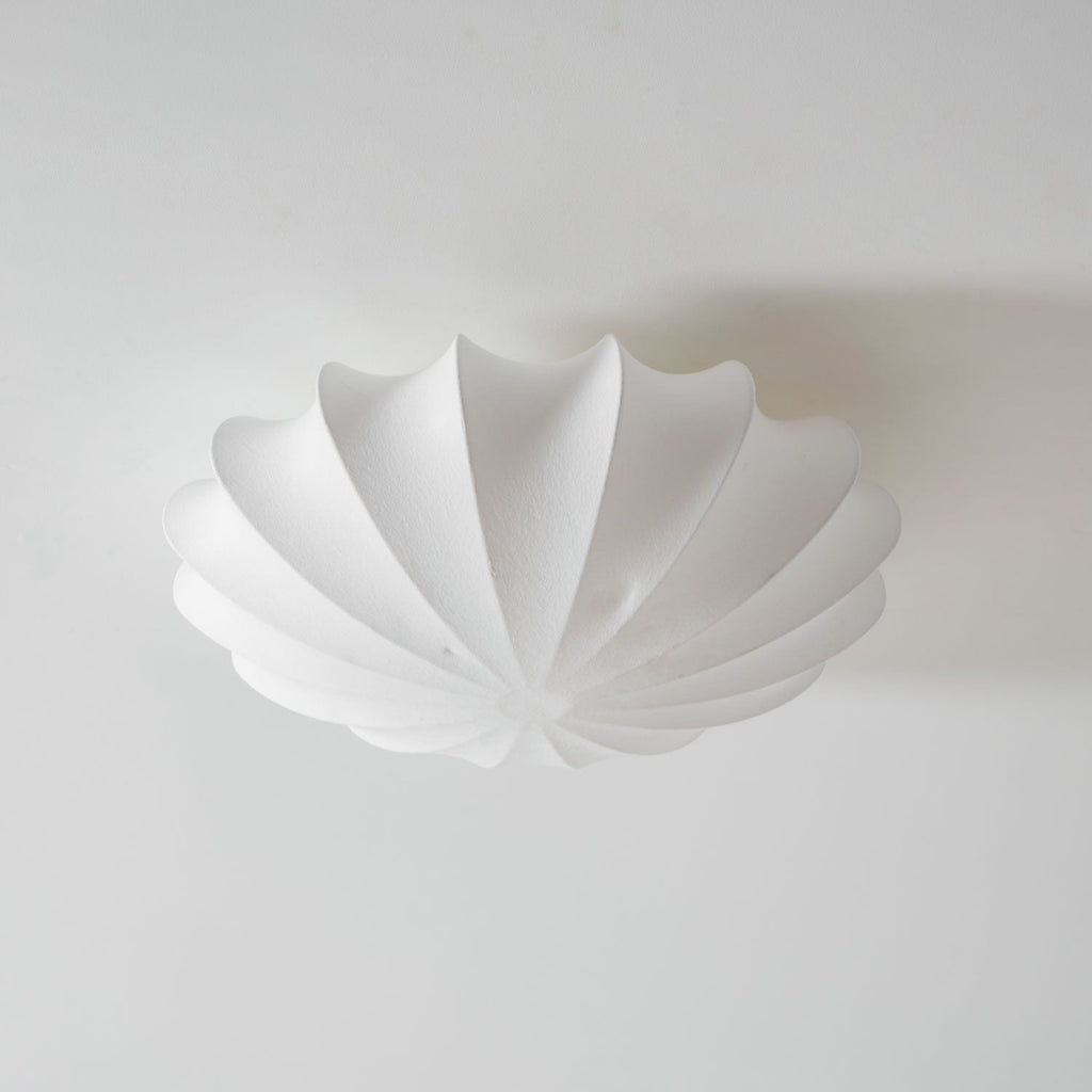 Nelson Bubble ceiling lamp with a silk cover over a steel wireframe casting a soft glow