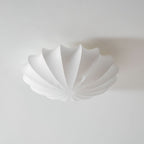 Nelson Bubble ceiling lamp with a silk cover over a steel wireframe casting a soft glow