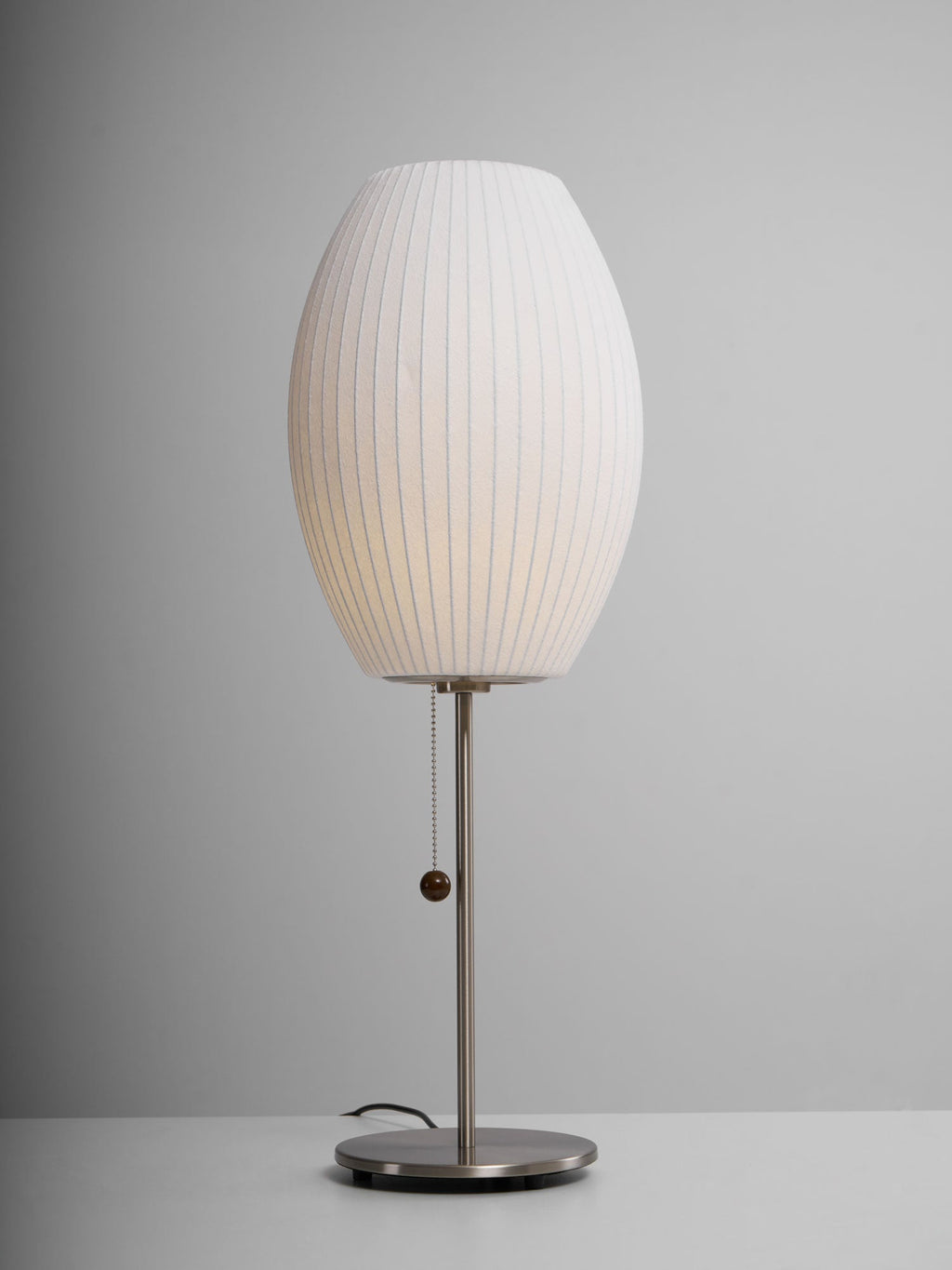 Faux silk bubble table lamp showing the pull-chain switch with wood accent