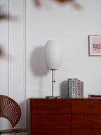 Side profile of the faux silk bubble table lamp and round chrome base