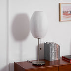 Close detail of the faux silk bubble shade's soft texture and curved form