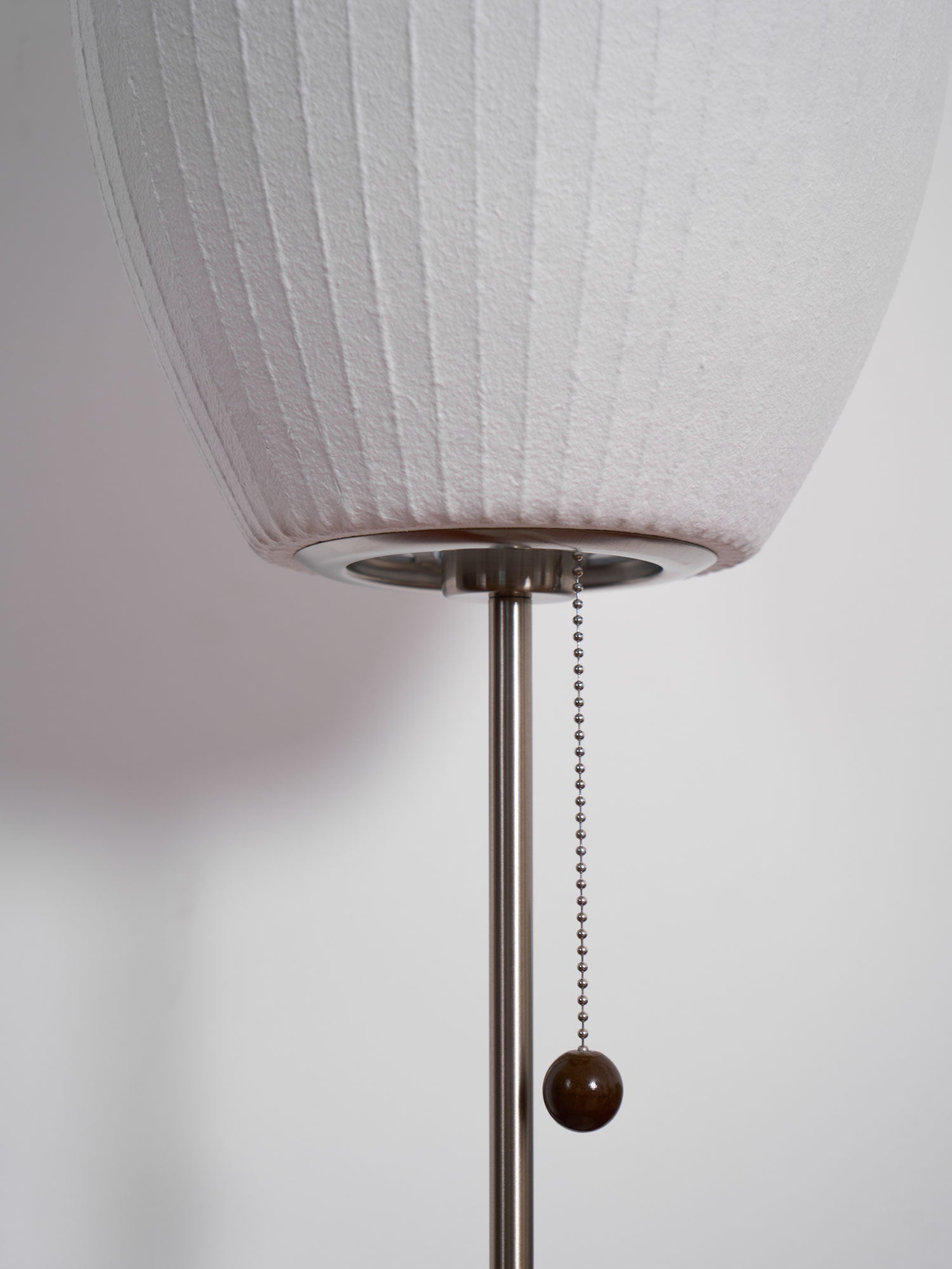 Faux silk bubble table lamp styled beside a sofa for warm ambient light