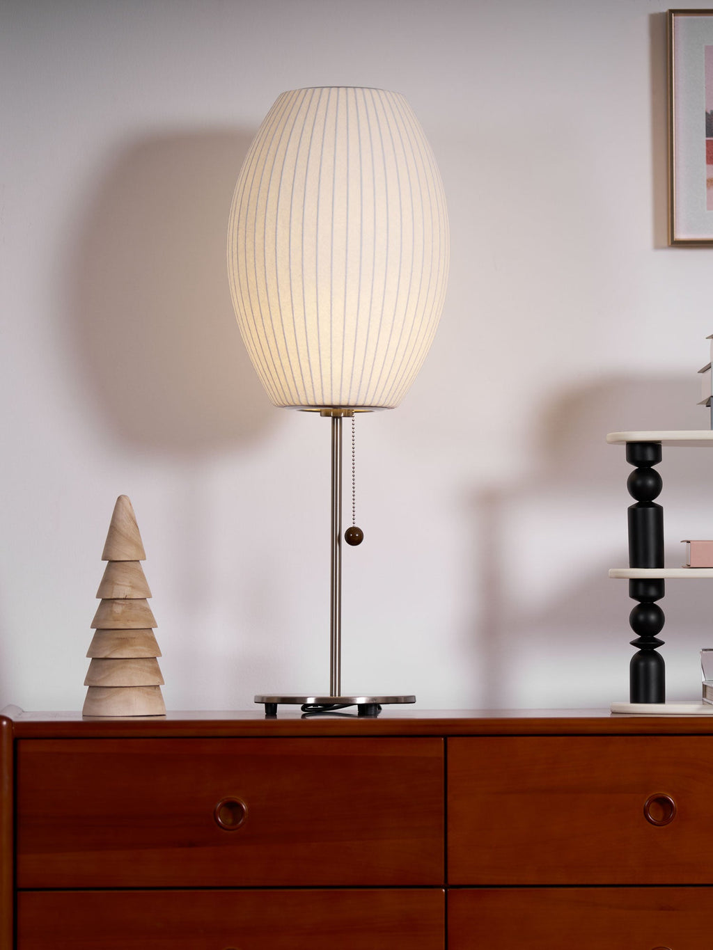 Faux silk bubble table lamp on a bedside table casting a soft diffused glow