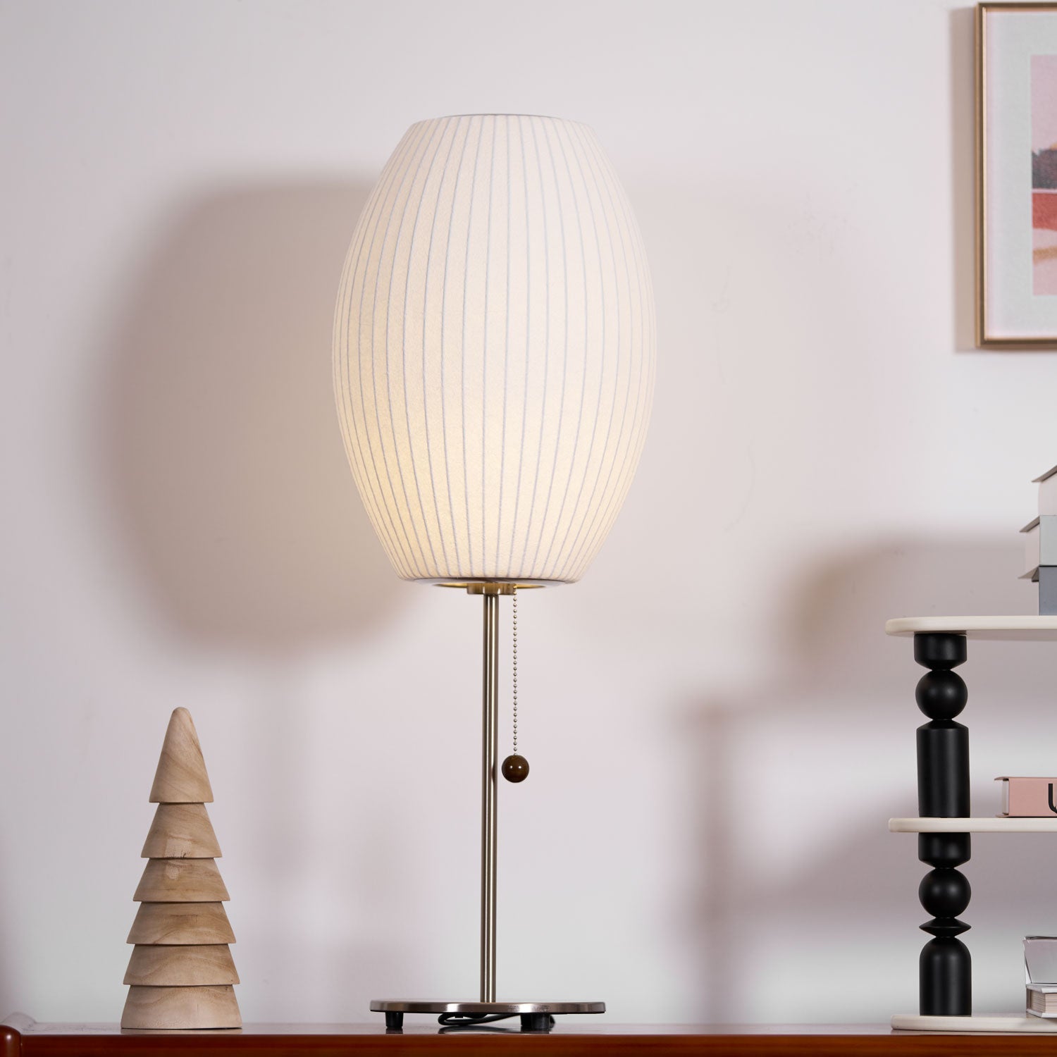 Faux silk bubble table lamp on a bedside table casting a soft diffused glow