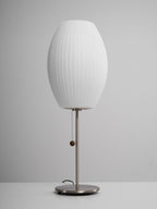 Close detail of the faux silk bubble shade's soft texture and curved form