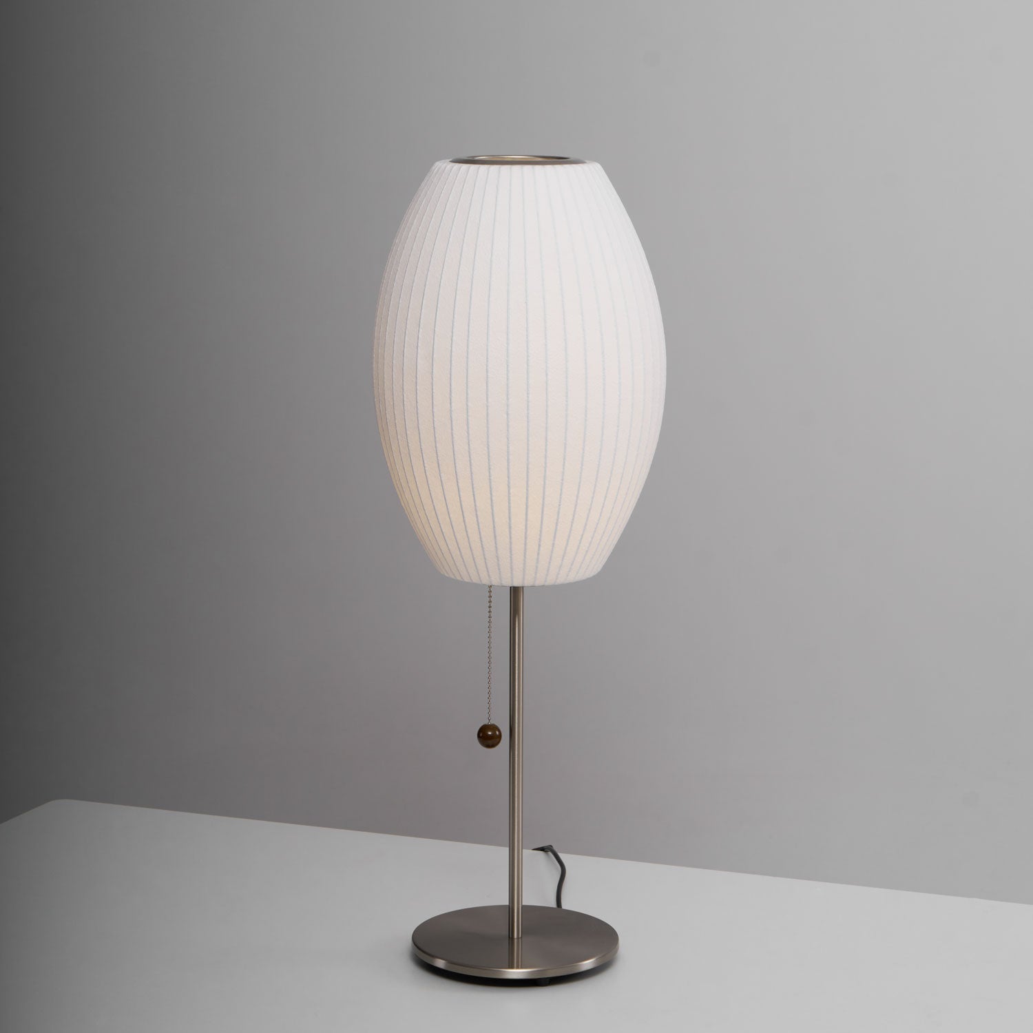 Faux silk bubble table lamp showing the pull-chain switch with wood accent