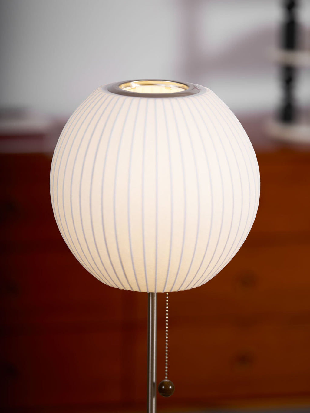 Faux silk bubble table lamp styled beside a sofa for warm ambient light