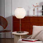 Side profile of the faux silk bubble table lamp and round chrome base