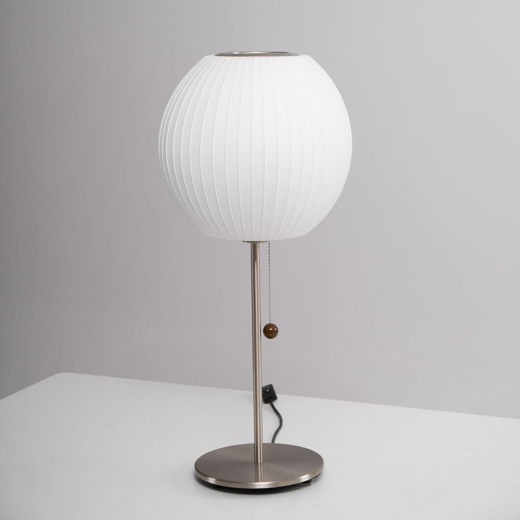 Close detail of the faux silk bubble shade's soft texture and curved form