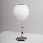 Close detail of the faux silk bubble shade's soft texture and curved form