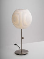Close detail of the faux silk bubble shade's soft texture and curved form