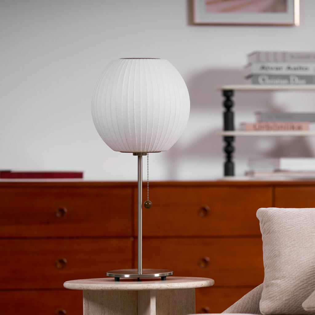Faux silk bubble table lamp styled beside a sofa for warm ambient light