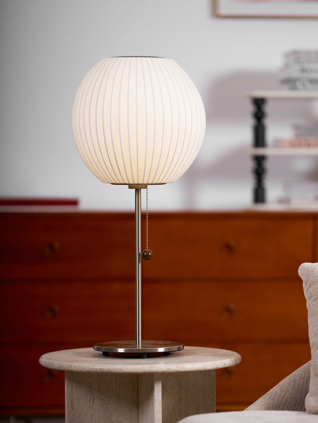 Close detail of the faux silk bubble shade's soft texture and curved form