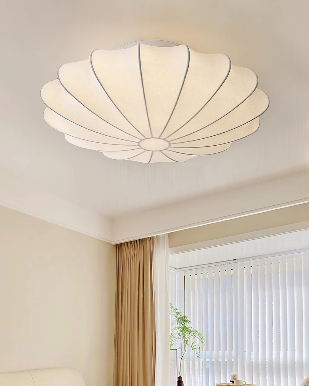 Nelson Bubble ceiling lamp over a dining setting giving off a warm refined light