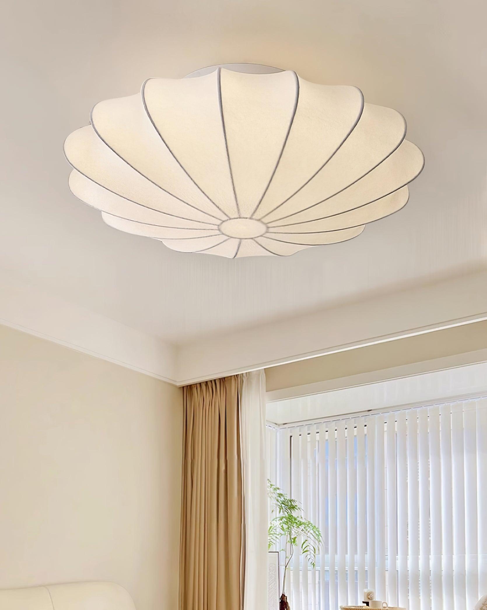 Nelson Bubble ceiling lamp over a dining setting giving off a warm refined light