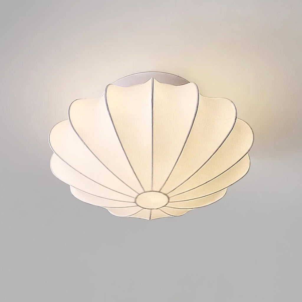 Nelson Bubble ceiling lamp shown lit, the silk diffusing warm ambient light