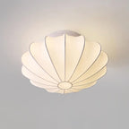 Nelson Bubble ceiling lamp shown lit, the silk diffusing warm ambient light