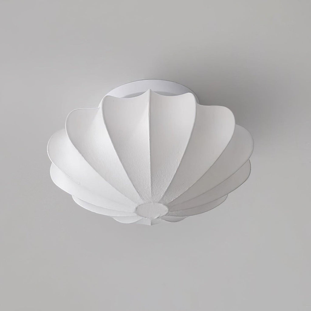 Nelson Bubble ceiling lamp over a dining setting giving off a warm refined light