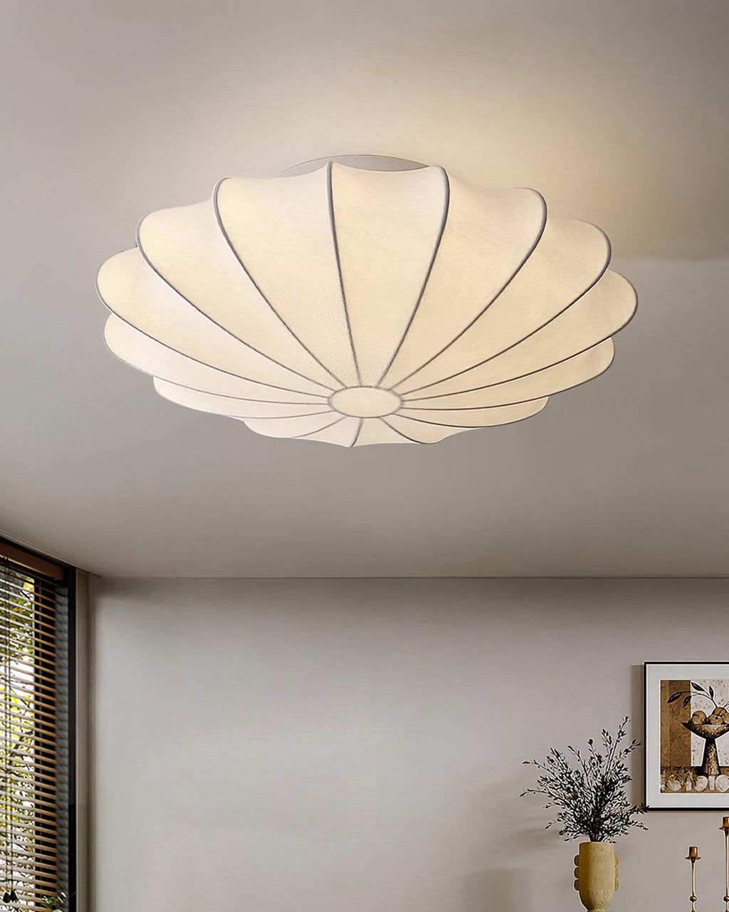 Nelson Bubble ceiling lamp with a silk cover over a steel wireframe casting a soft glow