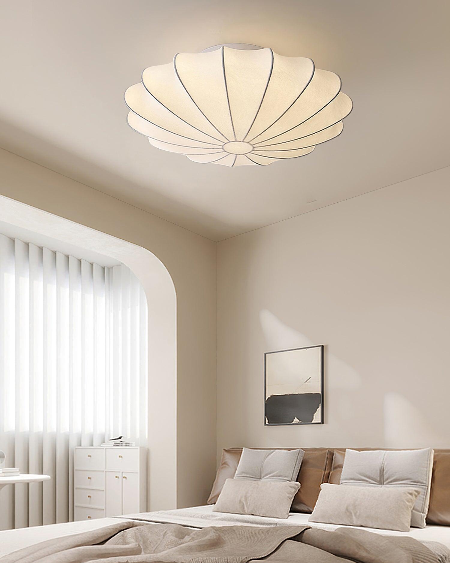 Nelson Bubble ceiling lamp shown lit, the silk diffusing warm ambient light