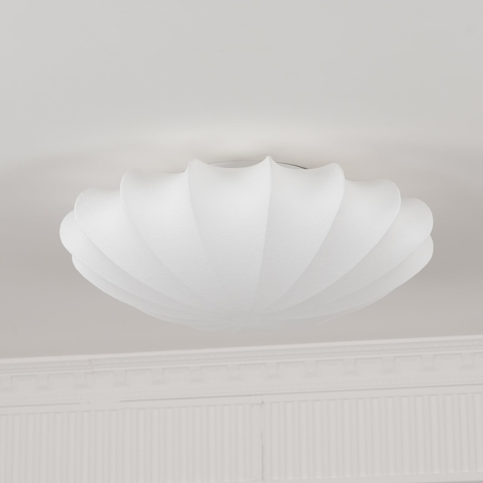 Nelson Bubble ceiling lamp in white viewed against a neutral ceiling