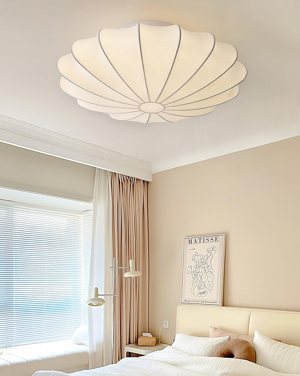 Nelson Bubble ceiling lamp over a dining setting giving off a warm refined light