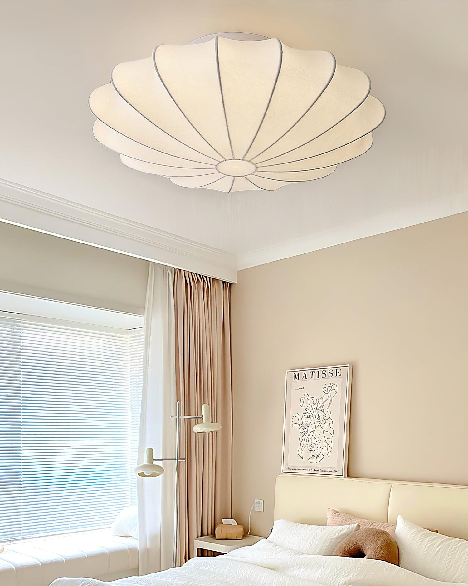 Nelson Bubble ceiling lamp over a dining setting giving off a warm refined light